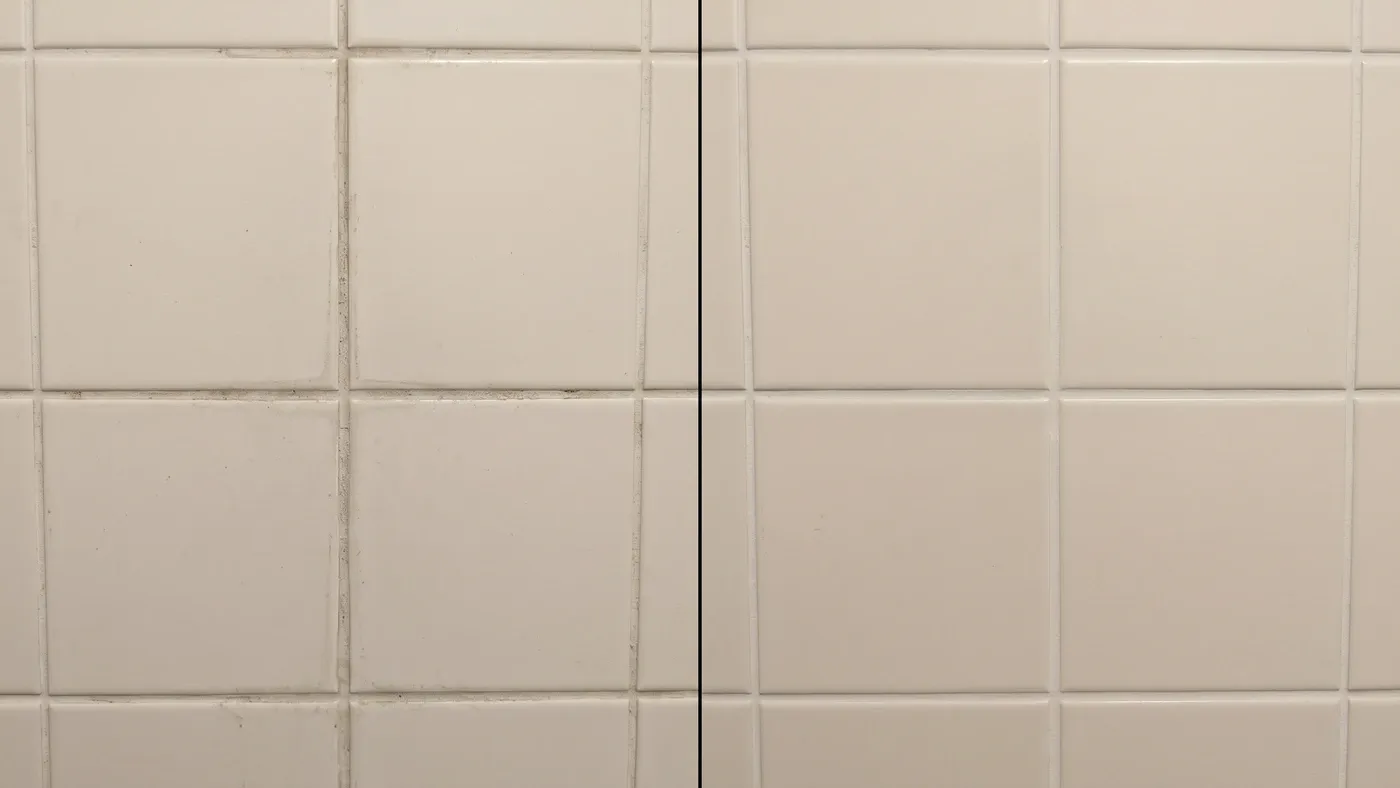Split-screen before and after of the same bathroom grout line, left side shows a light dark stain along the grout, right side shows the same grout cleaned and light-colored